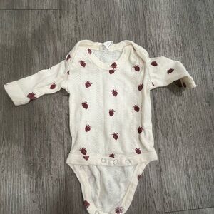 Kate Quinn Cream Bodysuit with Red Patterns